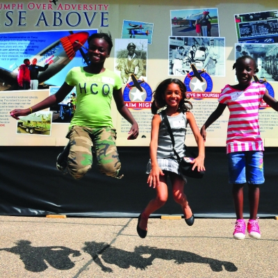 Children visit the RISE ABOVE traveling exhibit